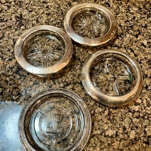 Set of Four Silver and Clear Glass ashtrays.